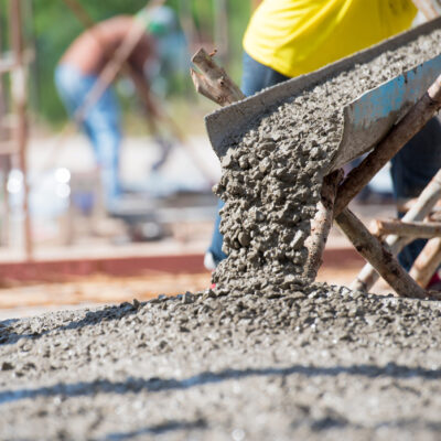 Concrete pouring during commercial concreting floors of building Concrete pouring during commercial concreting floors of building